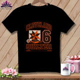 Black t-shirt featuring a Cleveland Quilter graphic with a quilt block, rotary cutter, and the number six.