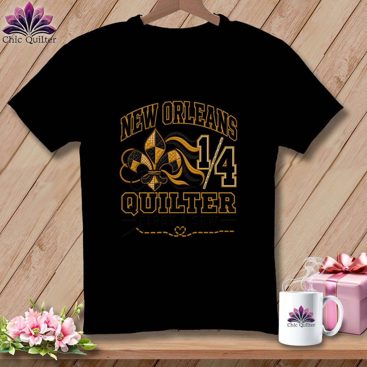 Black short-sleeved t-shirt with a New Orleans Quilter design featuring a fleur-de-lis and text.