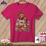 Bear sewing with fabric, thread spools, and a mug that says 