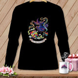 Black long-sleeve shirt with a colorful witch flying on a broomstick holding a patchwork quilt and text.