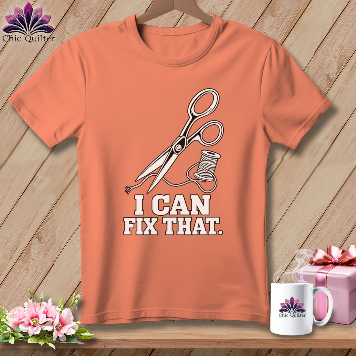 Peach t-shirt with scissors, thread, and "I CAN FIX THAT." text.