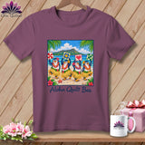 Plum t-shirt featuring a graphic of four hula-dancing penguins on a beach with the text Aloha Quilt Bee.