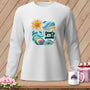 White long-sleeve shirt with a colorful quilting design featuring a sun and sewing machine.