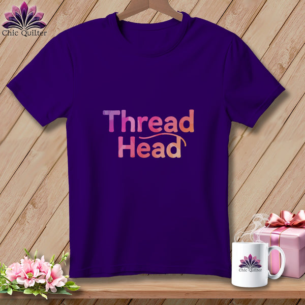 Purple t-shirt with "Thread Head" graphic and Chic Quilter logo on mug.