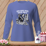 T-shirt graphic of skunk on sewing table with text 