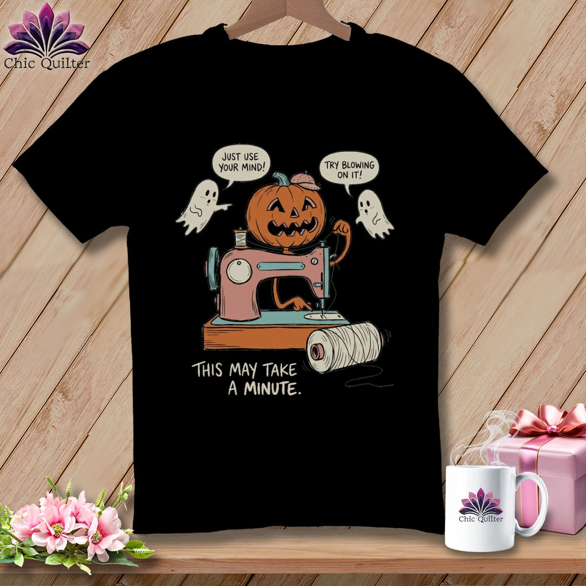 Jack-o'-lantern with sewing machine, ghosts, and text: "This may take a minute."
