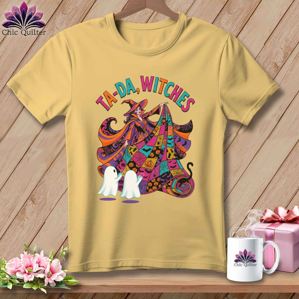 Yellow t-shirt with "Ta-da, Witches" graphic featuring a witch, ghosts, and Halloween motifs.