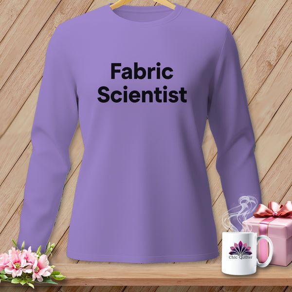 Purple long-sleeve shirt with "Fabric Scientist" text, floral mug, and gift box.