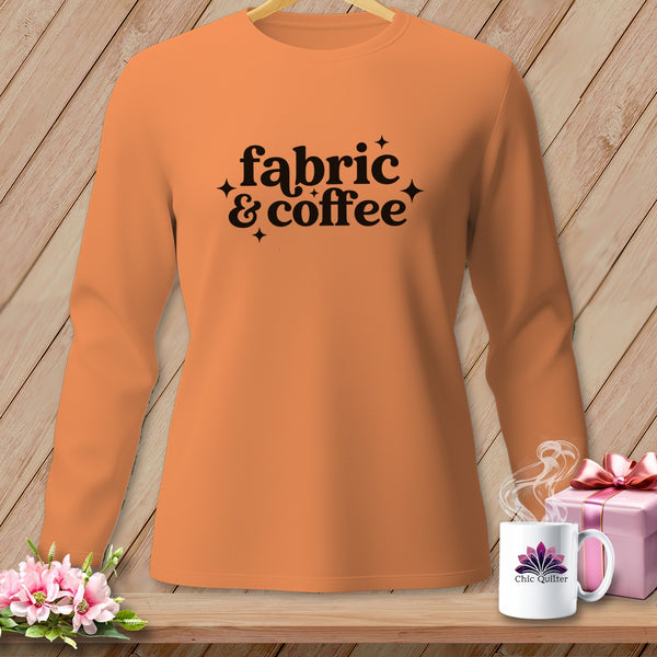 Orange long-sleeve shirt with "fabric & coffee" text and sparkling accents.