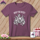 Plum crewneck t-shirt featuring a cartoon duck holding a torn quilt, with text reading WHAT THE DUCK?!