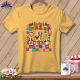 Yellow t-shirt featuring a cartoon graphic of farm animals peeking over a colorful patchwork quilt.