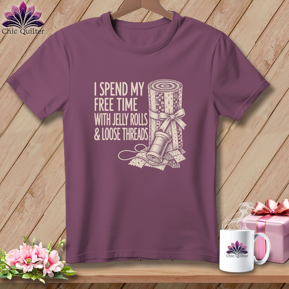 Plum t-shirt with "I spend my free time with jelly rolls & loose threads" text and quilt graphic.