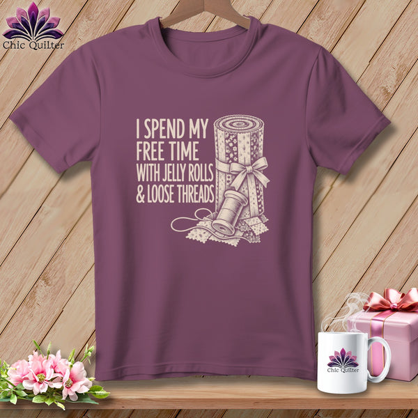Plum t-shirt with "I spend my free time with jelly rolls & loose threads" text and quilt graphic.