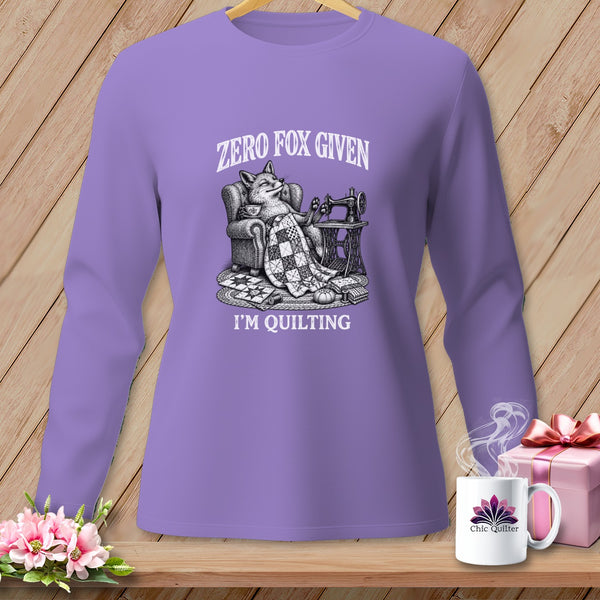 Lavender long-sleeve shirt with a fox knitting, "Zero Fox Given," and "I'm Quilting."