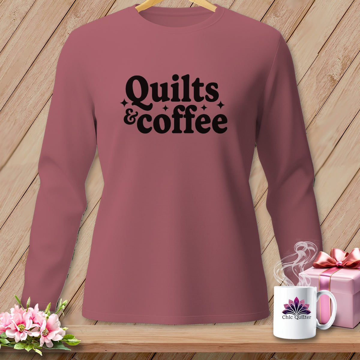 Rose-colored long-sleeve shirt with "Quilts & coffee" graphic.