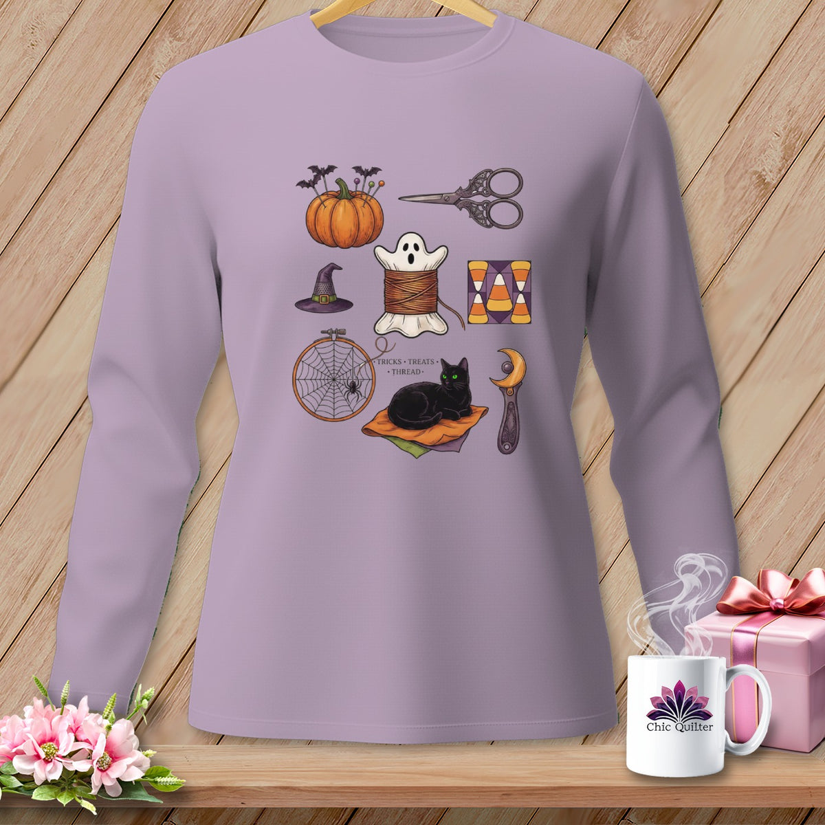 Purple long-sleeve shirt with Halloween-themed sewing illustrations and text.