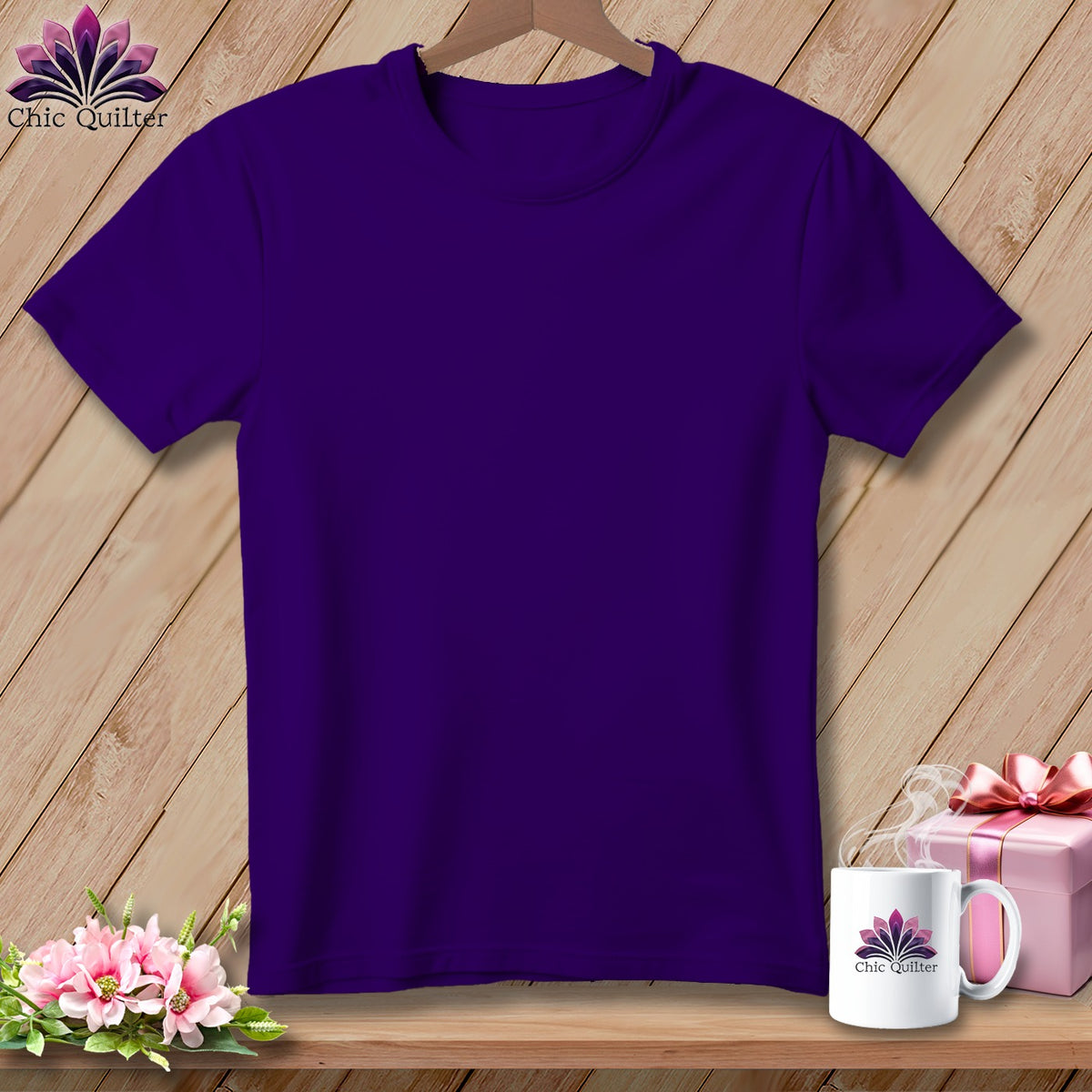 Dark purple t-shirt on a wooden background with a mug and gift.
