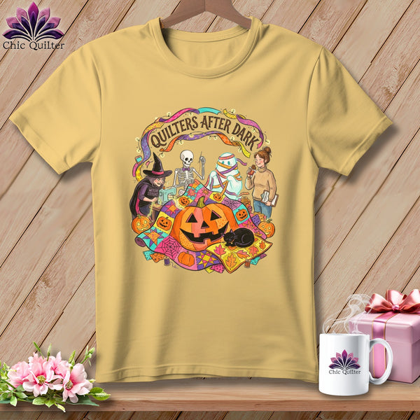 Yellow t-shirt with "Quilters After Dark" Halloween themed graphic.