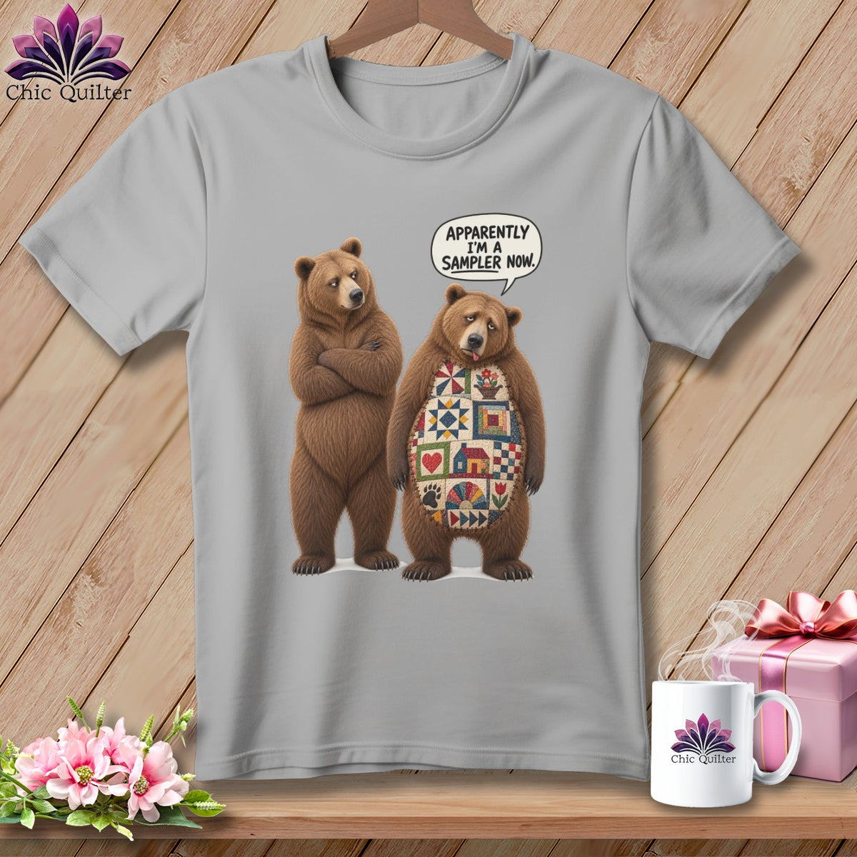 Two bears on a gray t-shirt, one with a quilt pattern, and a speech bubble.