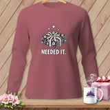 Pink long-sleeved shirt with a graphic of stacked fabric bundles and text 