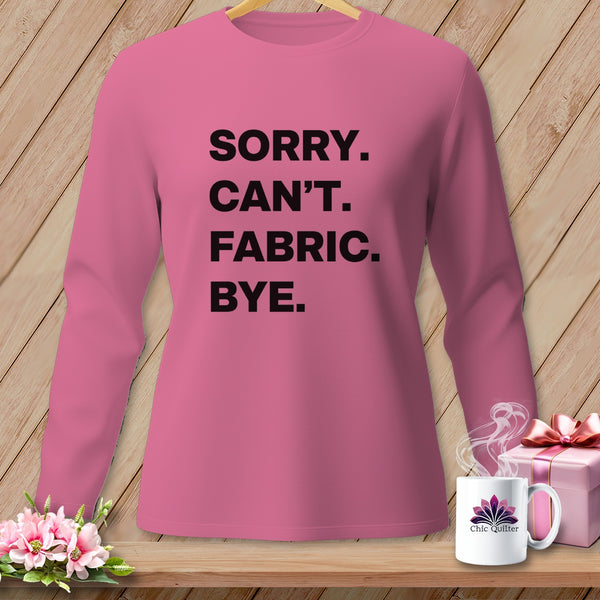 Pink long-sleeve shirt with black text "SORRY. CAN'T. FABRIC. BYE."