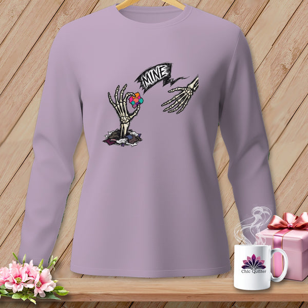 Skeleton hands reaching for a colorful heart graphic with the word "MINE".