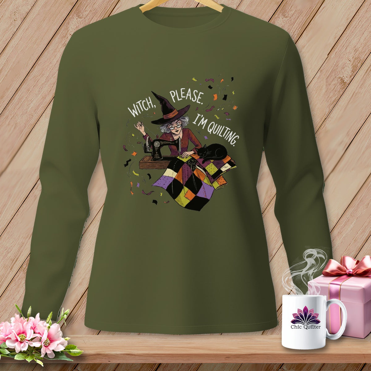 Witch, please, I'm quilting graphic on a green long-sleeve shirt.