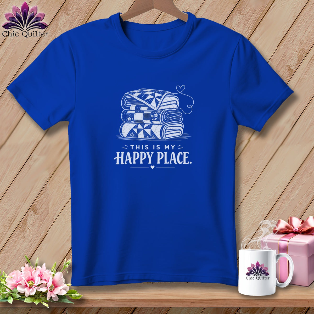 Blue t-shirt with stack of quilts and "This is my happy place" text.