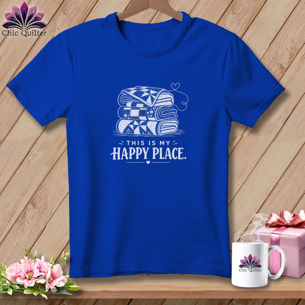 Blue t-shirt with stack of quilts and "This is my happy place" text.