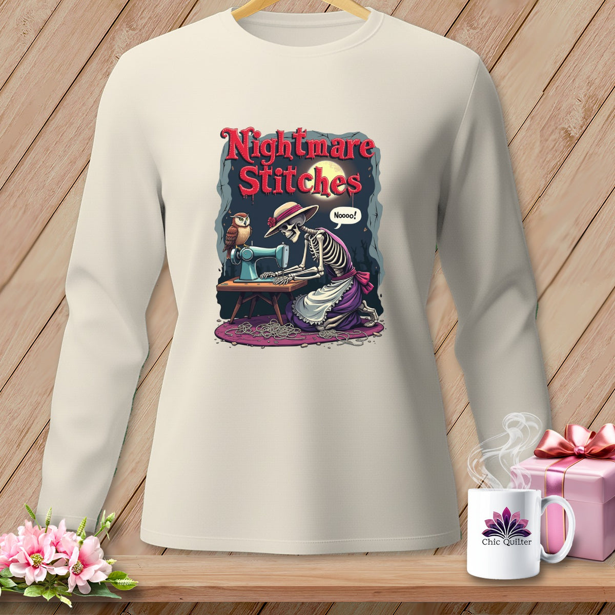 Skeleton sewing with owl, "Nightmare Stitches" text, on cream long-sleeve shirt.