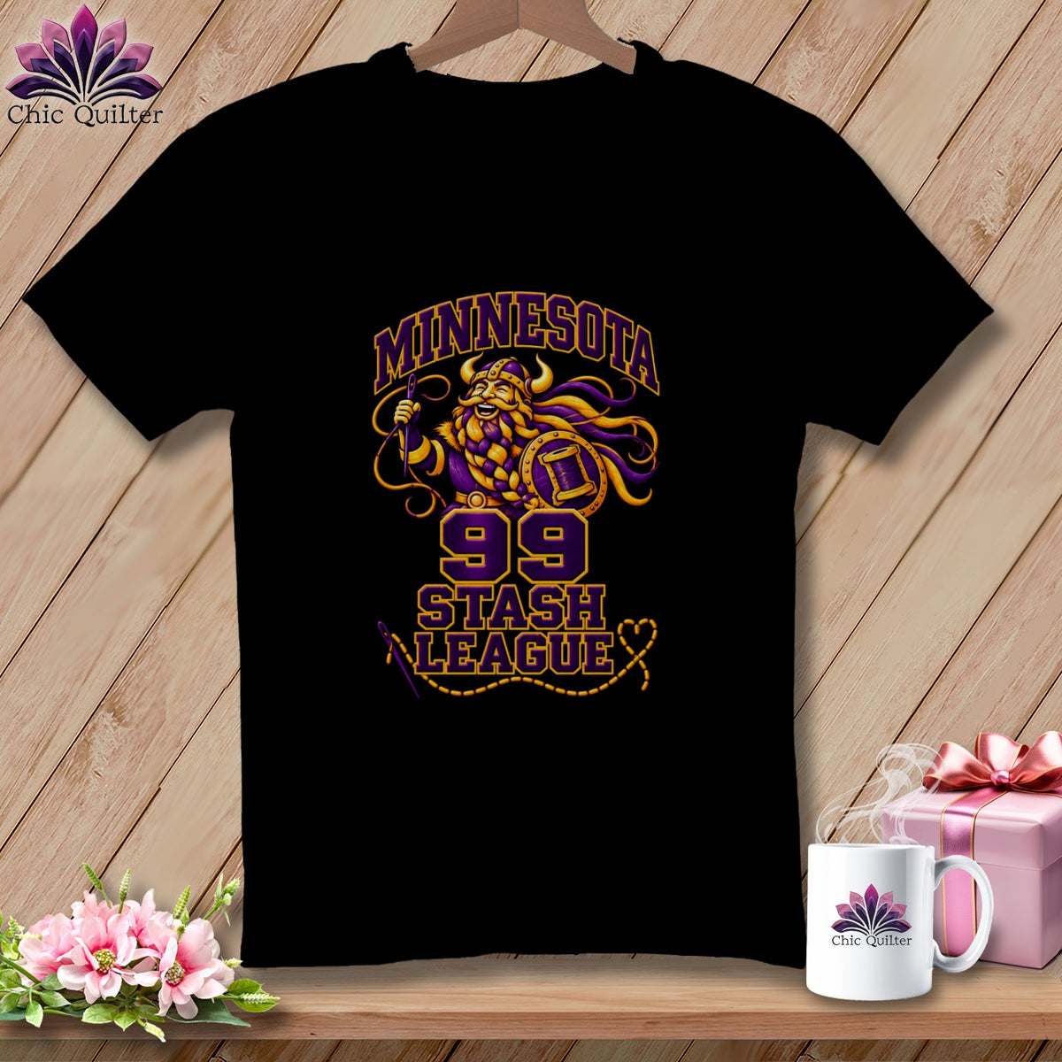 Black t-shirt featuring a Minnesota Stash League graphic with a Viking holding a needle and thread.