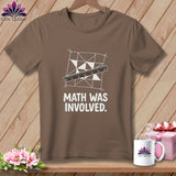 Brown t-shirt with a quilting pattern, ruler, and text 