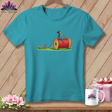 Teal short-sleeved t-shirt featuring a graphic of a person riding a giant red thread spool.