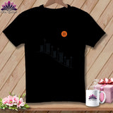 Black t-shirt with orange button and spools graphic, 