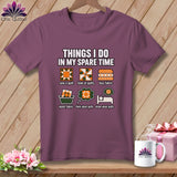 A plum-colored t-shirt on a wooden hanger with graphic text detailing quilting activities.