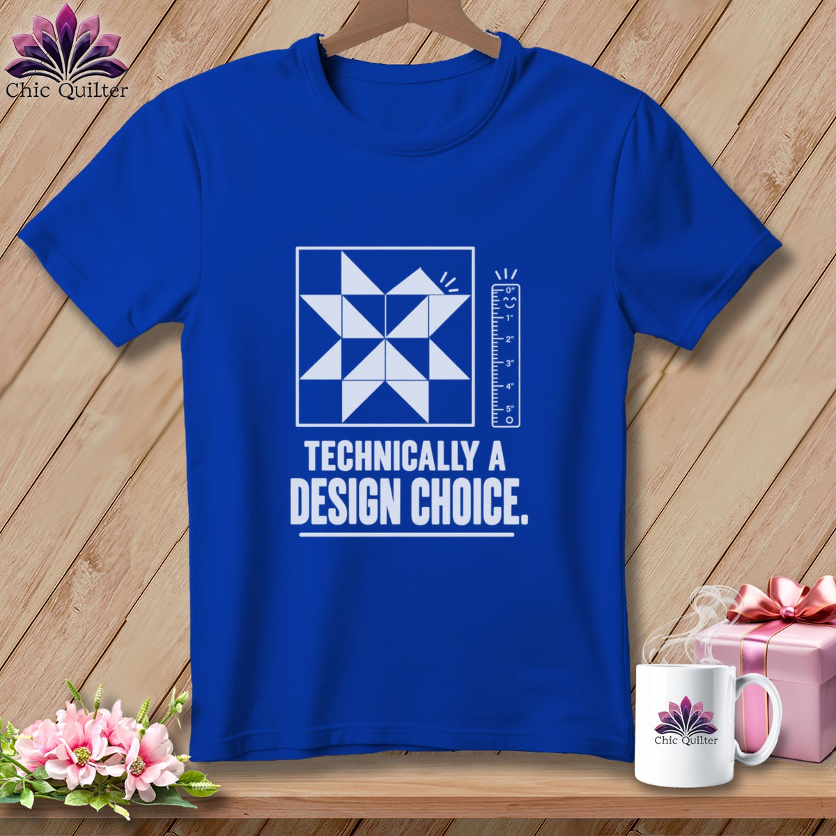 Royal blue t-shirt with a quilt block design and "Technically a Design Choice" text.