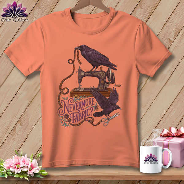 Peach t-shirt with ravens, sewing machine, tape measure, and text "Nevermore Fabric?".