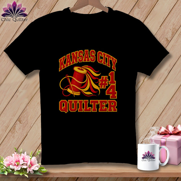Black t-shirt featuring a red and yellow Kansas City Quilter graphic with a spool of thread.