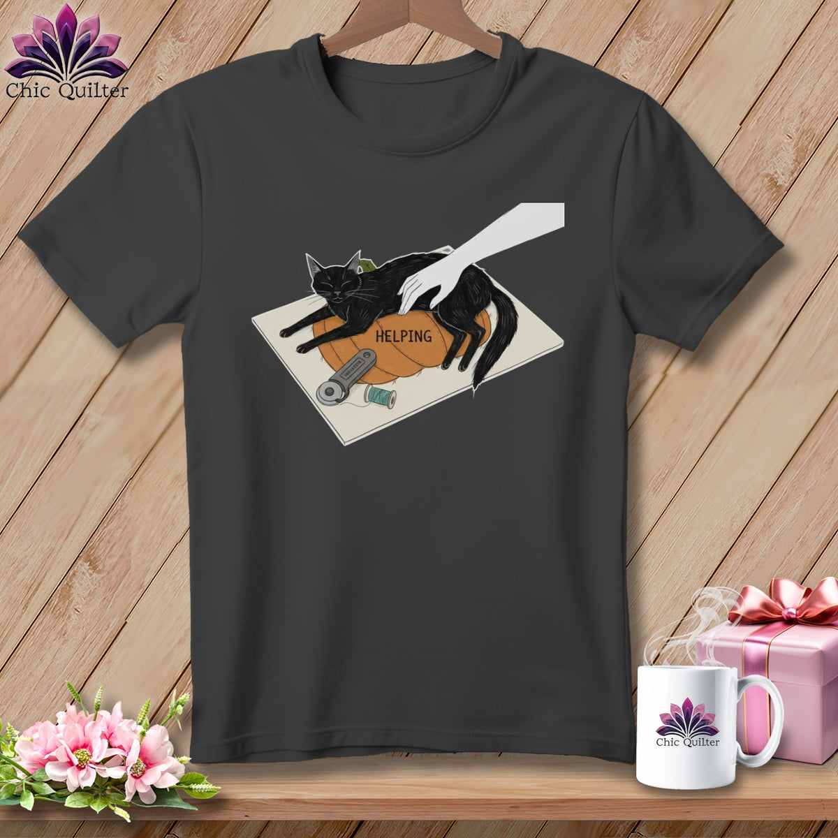 Black cat on a pumpkin with a hand petting it and the word "HELPING".