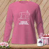 Pink long-sleeved shirt with white sewing machine graphic and 