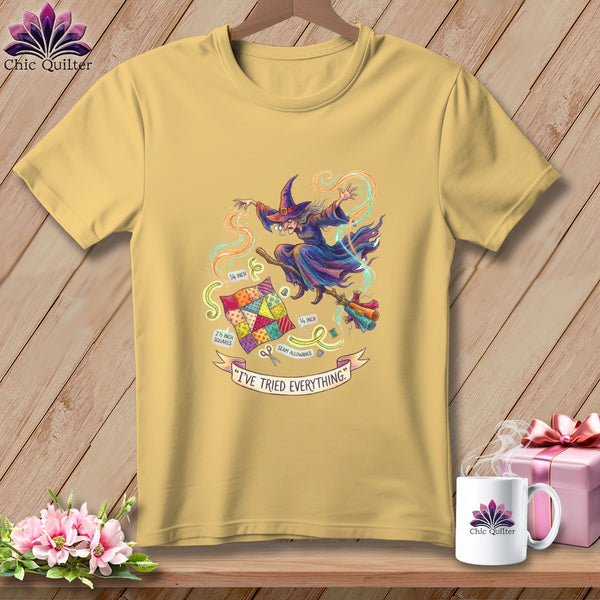 Yellow t-shirt with a witch flying on a broomstick with a quilt and sewing notions.