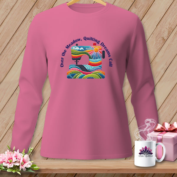 Pink long-sleeve shirt with a colorful sewing machine graphic and text.