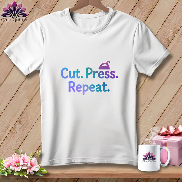 White t-shirt with "Cut. Press. Repeat." and an iron graphic.