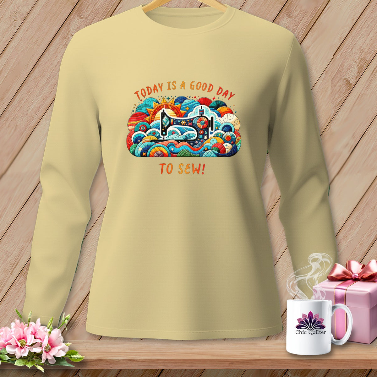 Long-sleeve shirt with "Today is a good day to sew!" graphic.