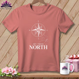 Coral t-shirt with white compass graphic and text 