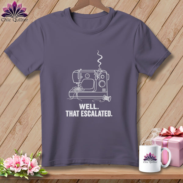 Purple t-shirt with a white line drawing of a sewing machine and text.