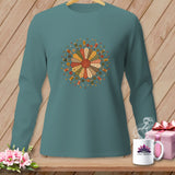 Teal long-sleeved shirt with a circular sewing-themed graphic and 