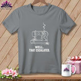 Gray t-shirt with white line drawing of a sewing machine and text: 