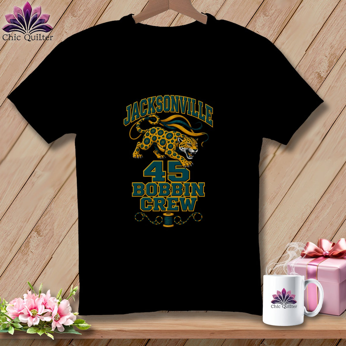 A black t-shirt features a graphic with a jaguar, the text JACKSONVILLE 45 BOBBIN CREW, and a sewing spool.
