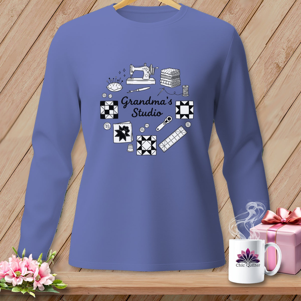 Periwinkle long-sleeve shirt with "Grandma's Studio" graphic of sewing items.
